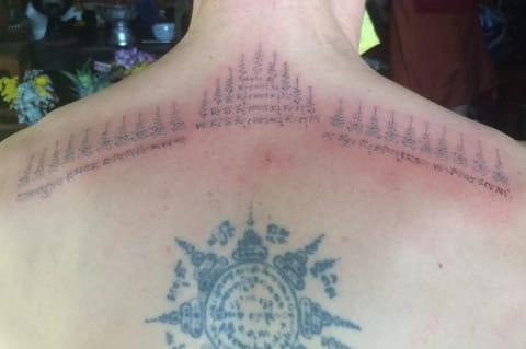 CMLocals Chiang Mai Locals Sak Yant monk ritual tattooing sacred tattoo on back